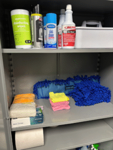 Properly labeled commercial cleaning chemicals stored in Roanoke office janitor closet Safety Data Sheet binder for workplace cleaning chemicals Secure janitorial chemical storage setup in commercial building